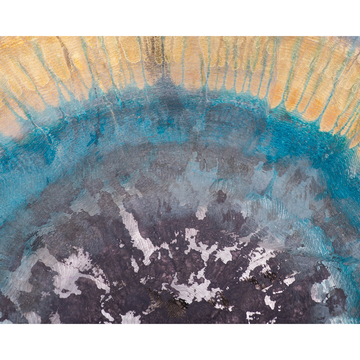 detail view of yellow blue and black round metal wall art