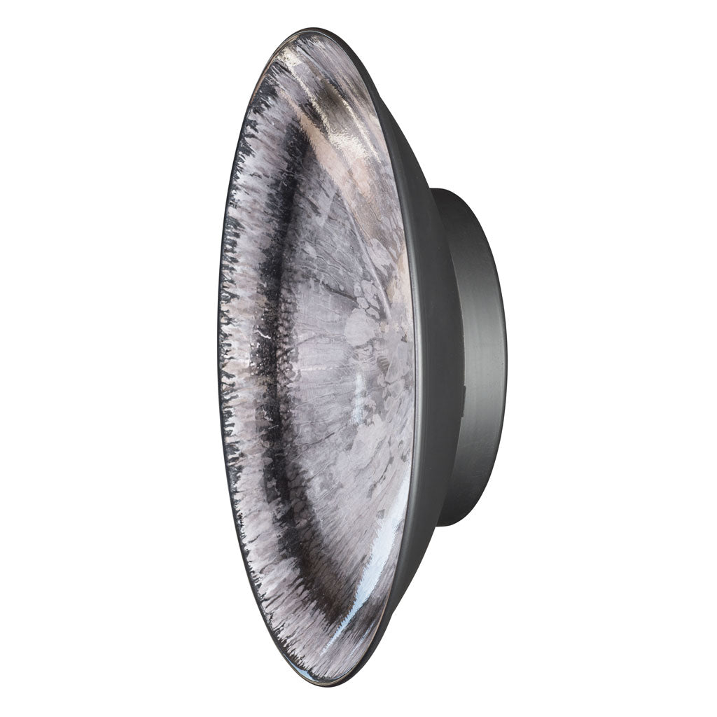 round black and white metal wall art